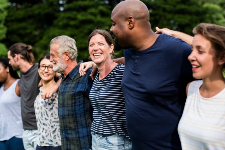 Families coming together with arms around each other